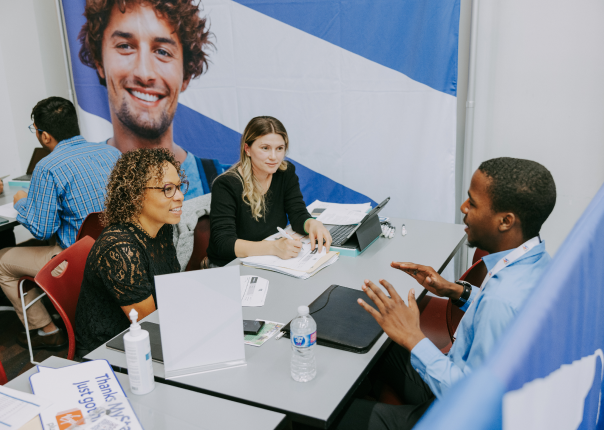 Group of people talking at MyStartr event