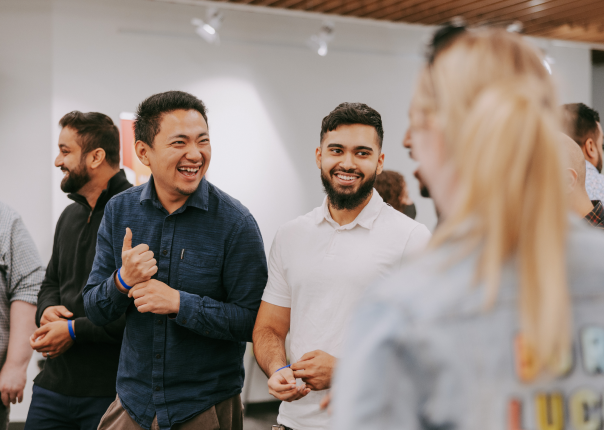 Group of people smiling at event