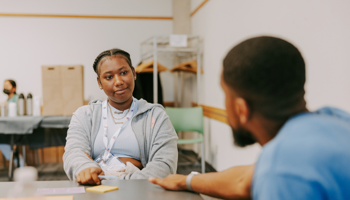 Young person talking with mentor